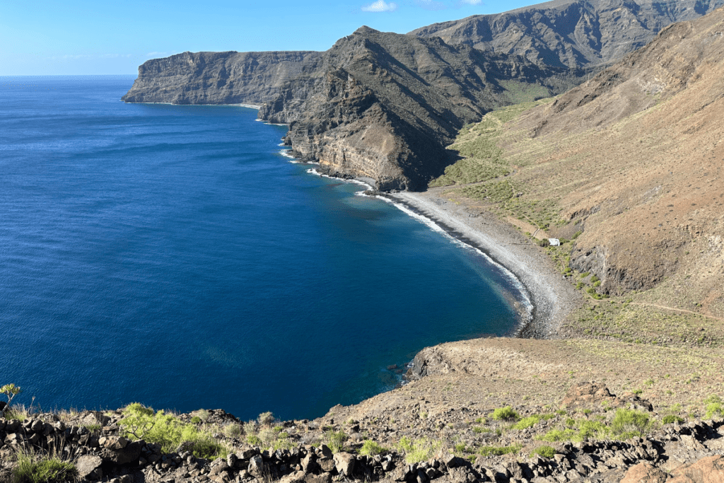 Playa De La Guancha View From Cliff Top With Pebbled Beach Black Cliffs And Sparkling Sea On Sunny Day Best Beaches In San Sebastian De La Gomera Canary Islands Spain